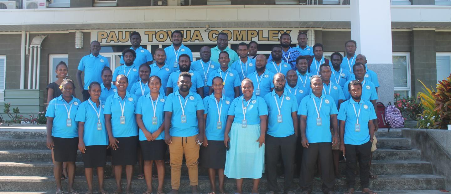 Guadalcanal Province teachers who are recipients of the SECOND TEACHERS RESOURCE BOOK WORKSHOP pose for a photo shoot with the Director Marisa Pepa and staff of the Parliamentary Civic Education Department.