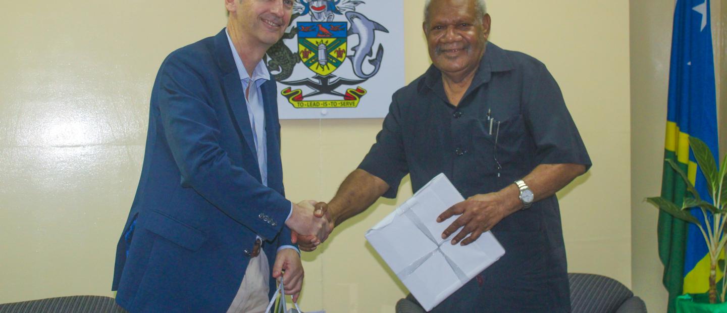 President of the Legislative Council of New South Wales Parliament Hon. Matthew Mason Cox exchange gifts with the Speaker of the National Parliament of Solomon Islands Hon. John Patteson Oti at the Speaker’s Lounge.